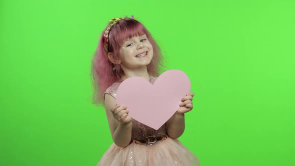 Child Girl Princess Holds Pink Paper Heart. Mothers Day, Valentines Day Concept