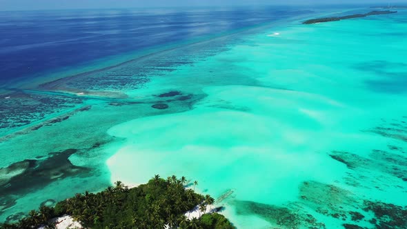 Wide angle above island view of a white paradise beach and turquoise sea background in best quality 