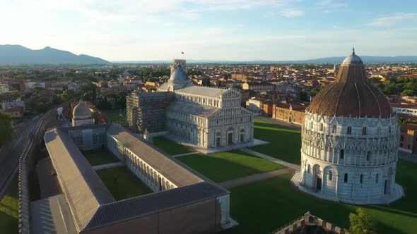 Aerial view of Piazzale dei Miracoli in Pisa at sunset, Italy.