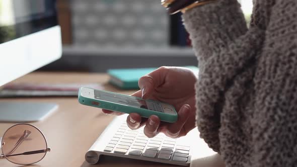 Young Woman Scrolling Using her Smartphone