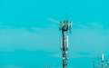 Telecommunication tower with blue sky background. Radio and satellite pole. Communication technology - PhotoDune Item for Sale