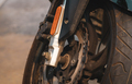 Closeup disc brake of motorcycle. Motorbike accessory. Aluminum alloy wheel of dirty motorcycle. - PhotoDune Item for Sale