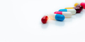 Selective focus on antibiotic capsule pills on white background. Pharmacy horizontal web banner. - PhotoDune Item for Sale