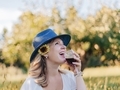 Young millennial girl at a winery drinking wine, laughing and having fun  - PhotoDune Item for Sale