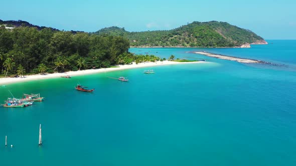 Aerial sky of beautiful resort beach time by blue ocean and white sandy background of a dayout near 