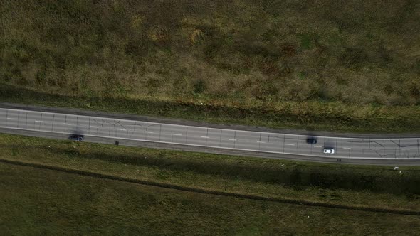 Aerial Top Down  View of Car Traffic Driving on Country Road