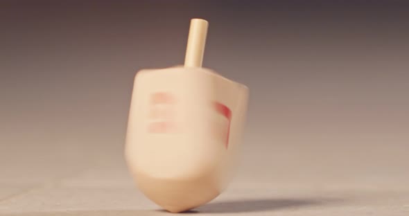 Slow motion of a Hanukka dreidel spinning