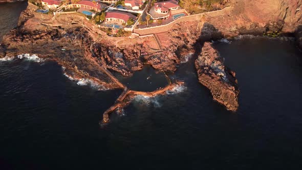 View of coastal town next to the sea drone aerial bird view, Puerto de Santiago, Los Gigantes, Tener