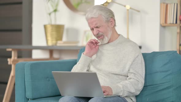 Laptop Work By Old Man with Neck Pain on Sofa