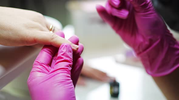 Manicure Artist Making Professional Manicure in Beauty Salon