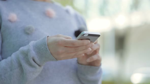 Female Hands Using Smartphone.