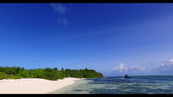 Aerial panorama of tranquil island beach break by blue sea and white sand background of a dayout nea