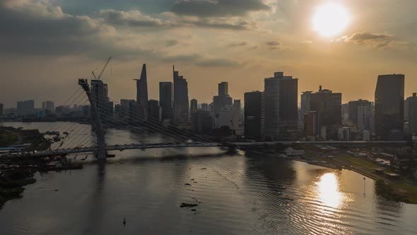 Classic drone hyperlapse view and establishing shot of Saigon river, Vietnam from drone with bridge