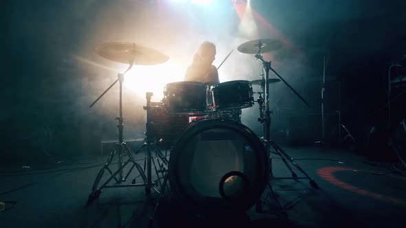 Dark Music Studio and a Man Playing Drums