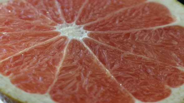 Fresh Half Cut Grapefruit is Rotating Closeup Shot