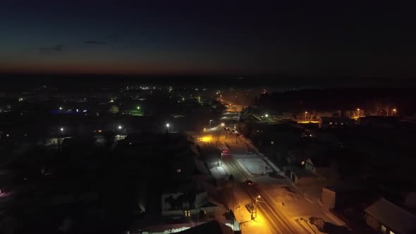 Aerial view of night village in winter with snow 05