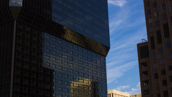 Reflection Of Blue Sky With Clouds On Glass Exterior Of A Modern Building In Downtown Colorado Sprin