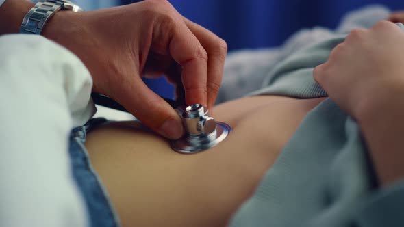 Doctor Hands Using Stethoscope Closeup