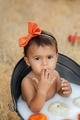 Little baby girl in milk bath with pumpkins, autumn season, fall toddler portrait  - PhotoDune Item for Sale