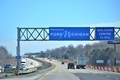 Traveling on the interstate with road signs welcoming you into their state Pure Michigan - PhotoDune Item for Sale