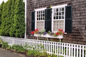  a white picket fence in Edgartown on Martha’s Vineyard, Cape Cod, Massachusetts
