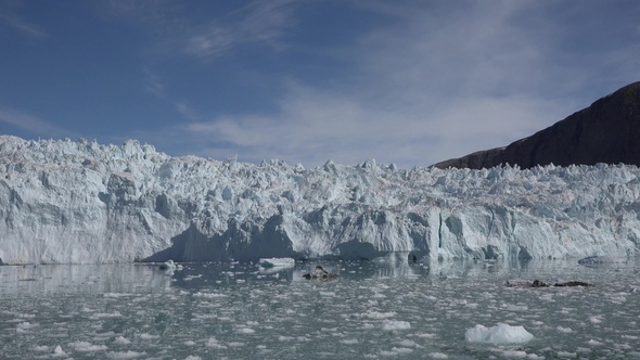 Climate change. Melting glaciers and icebergs in the ocean. Unesco World Heritage Site.