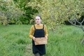 Woman walking in apple garden - PhotoDune Item for Sale
