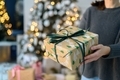 Woman holding gift boxes with Christmas decorations - PhotoDune Item for Sale