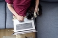 Man working on laptop with his cat - PhotoDune Item for Sale