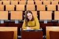 Woman student in empty classroom - PhotoDune Item for Sale