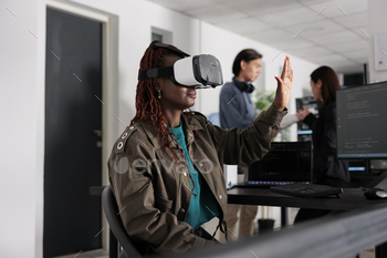 e programming server with html script on terminal window. System engineer using virtual reality glasses to plan new interface.