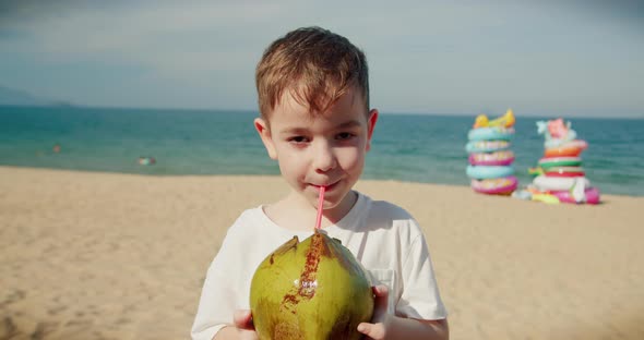 Portrait Happy Funny Little Boy Child Drinking Coconut Fruit Cute Smiling Kid Drinks a Coconut