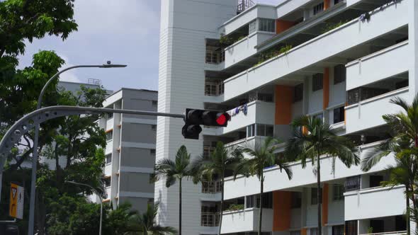 Traffic light changing from red to green. Streets of Singapore