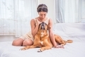 Beautiful girl spending time with her pet dog at home. - PhotoDune Item for Sale