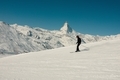 A skier in the Swiss alps with the iconic Matterhorn in the distance  - PhotoDune Item for Sale