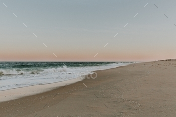 n waves crashing on the sand at the Delaware Seashore State Park beach at sunset by Dorey Kronick