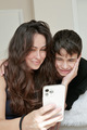 young beautiful brunette woman with long hair communicates via video call with a teenager son - PhotoDune Item for Sale