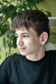 Close up portrait of deaf boy with cochlear implants  - PhotoDune Item for Sale