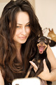 young brunette girl with long hair with a dog in her arms - PhotoDune Item for Sale