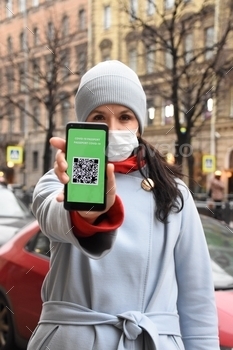 pp mobile valid digital green vaccination certificate for new coronavirus infection Covid-19. Vaccination certificate, health passport for new normal life in city. Russia, Saint-Petersburg