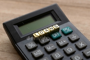 ads of word Loans on wooden background.bank, home, debt, income, mortgage, accounting, concept, credit, profit, budget, account, wealth, document, house, economy, management, person, bill, cost, people, currency, growth, calculating, balance, occupation, student, graph, investing, interest, online, internet, property, contract, agreement, car, auditor, deadline, time, economic, calculate