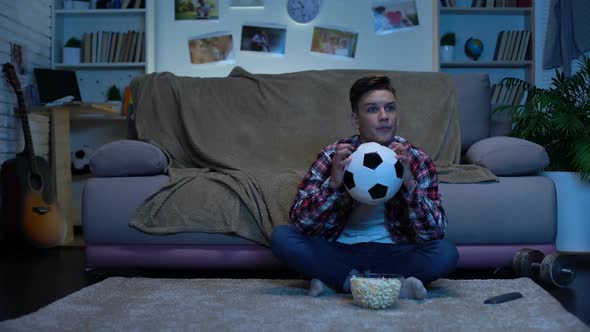 Teenage Soccer Fan Cheering for Favorite Team at Home, National Competition