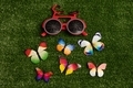 Red bike glasses and little colorful butterflies - PhotoDune Item for Sale