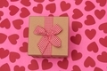 Valentine's Day present and red hearts on pink background - PhotoDune Item for Sale