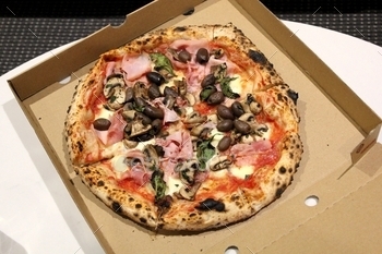 Pizza in a cardboard pizza box