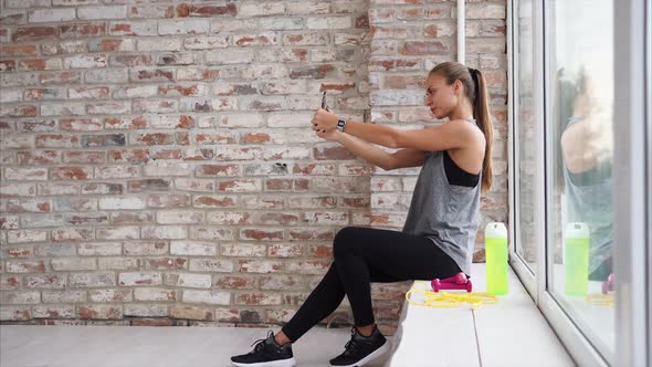 Beautiful Woman is Taking Selfie After Training