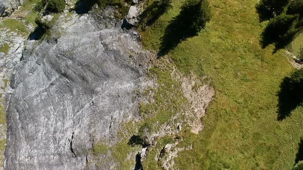 Aerial shot of a hiking trail in the swiss alps