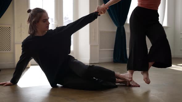 Young People are Dancing in Hall Dancing Pair is Rehearsing Contemporary Choreography