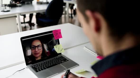 Manager Using Laptop for Video Talk To Colleague