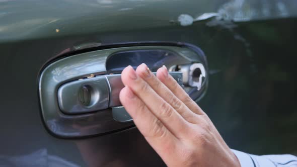 Close Up Young Woman Driver Looking at Scratch Damage of Her Car. 